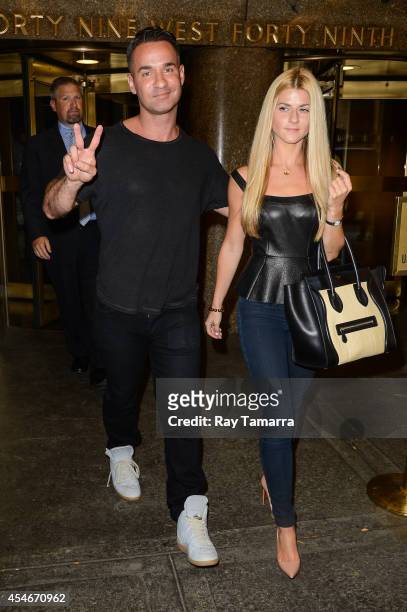 Television personality Mike Sorrentino and Lauren Pesce leave the Rockefeller Center Studios on September 4, 2014 in New York City.