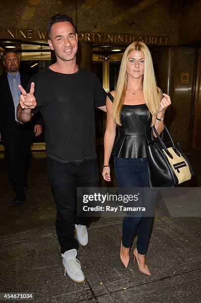 Television personality Mike Sorrentino and Lauren Pesce leave the Rockefeller Center Studios on September 4, 2014 in New York City.