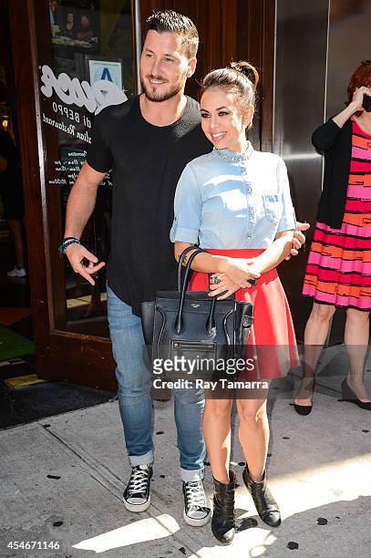 Professional dancer Val Chmerkovskiy and actress Janel Parrish leave Planet Hollywood Times Square on September 4, 2014 in New York City.