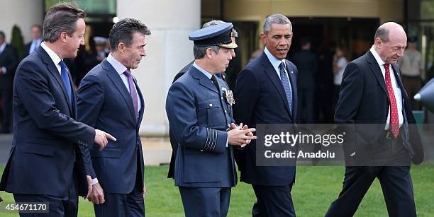 President Barack Obama , President of Romania Traian Basesku , British Prime Minister David Cameron and NATO Secretary General Anders Fogh Rasmussen...