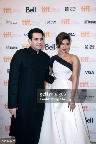 Director Omung Kumar and Actress Priyanka Chopra arrive at the premiere for "Mary Kom" during the 2014 Toronto International Film Festival at The...