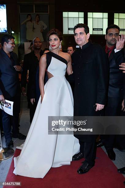 Actress Priyanka Chopra and Director Omung Kumar arrive at the premiere for "Mary Kom" during the 2014 Toronto International Film Festival at The...