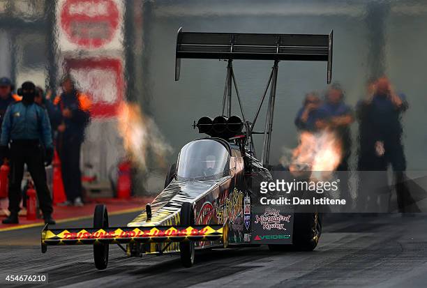 Top Fuel Car launches during qualifying for the European Drag Racing Championships at Santa Pod Raceway on September 5, 2014 in Podington, England.