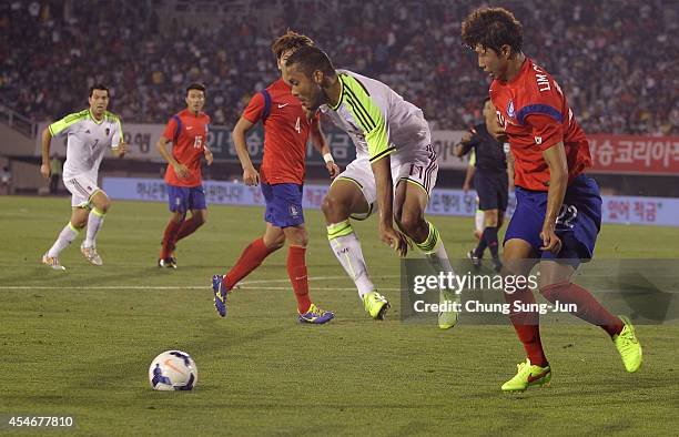 Juan Falcon of Venezuela competes for the ball with Lim Chai-Min of South Korea during the international friendly match between South Korea and...