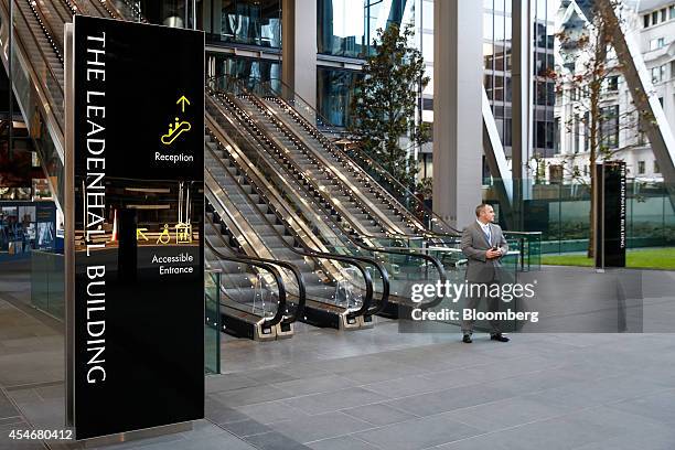 Security guard stands at the entrance to the Leadenhall Building, also known as the Cheesegrater, in the financial district of London, U.K., on...