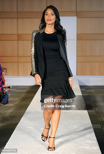 Model walks the runway at the Fashion Law Institute fashion show during Mercedes-Benz Fashion Week Spring 2015 at Fordham Law School on September 5,...