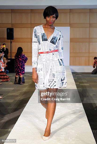 Model walks the runway at the Fashion Law Institute fashion show during Mercedes-Benz Fashion Week Spring 2015 at Fordham Law School on September 5,...