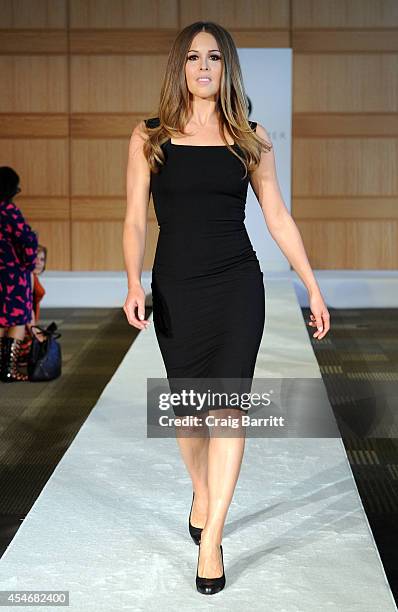 Model walks the runway at the Fashion Law Institute fashion show during Mercedes-Benz Fashion Week Spring 2015 at Fordham Law School on September 5,...