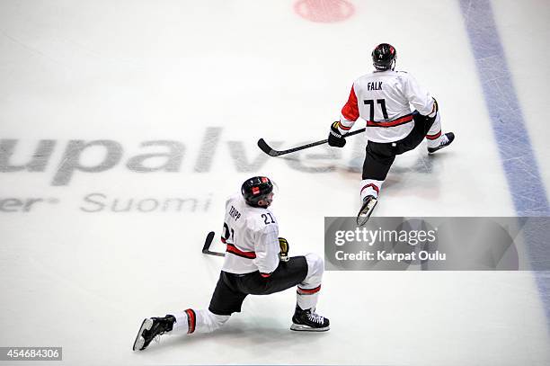 John Tripp and Andreas Falk of Koelner Haie at warm up during the Champions Hockey League group stage game between Karpat Oulu and Koelner Haie on...