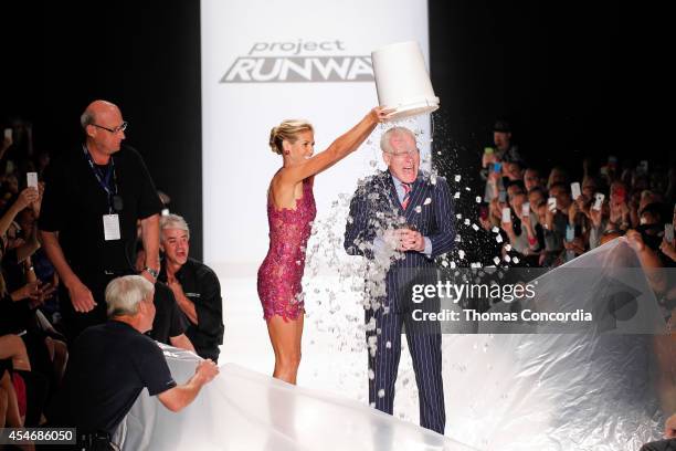 Heidi Klum pours ice on Tim Gunn for the ALS Ice Bucket Challenge during the Project Runway Season 13 Finale Show during Mercedes-Benz Fashion Week...