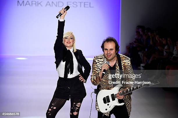 Fashion designers Estel Day and Mark Tango pose on the runway at the Mark And Estel fashion show during Mercedes-Benz Fashion Week Spring 2015 at The...