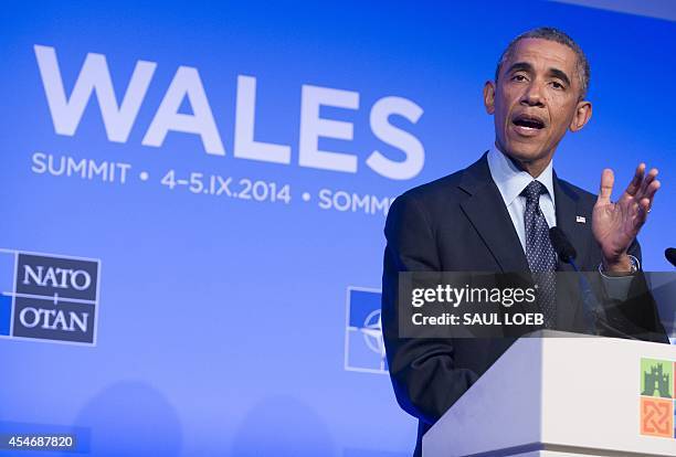President Barack Obama speaks at a press conference on the second day of the NATO 2014 Summit at the Celtic Manor Resort in Newport, South Wales, on...