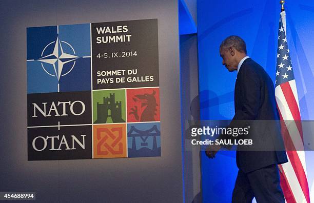 President Barack Obama leaves a press conference on the second day of the NATO 2014 Summit at the Celtic Manor Resort in Newport, South Wales, on...