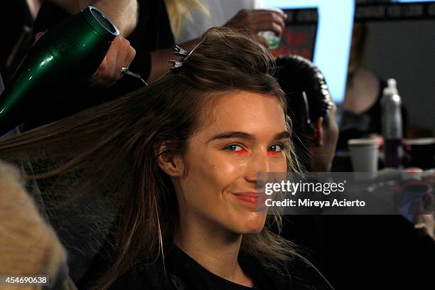 Model prepares backstage at the Peter Som fashion show during Mercedes-Benz Fashion Week Spring 2015 at Milk Studios on September 5, 2014 in New York...