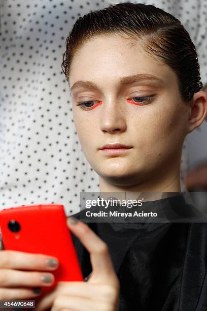 Model prepares backstage at the Peter Som fashion show during Mercedes-Benz Fashion Week Spring 2015 at Milk Studios on September 5, 2014 in New York...