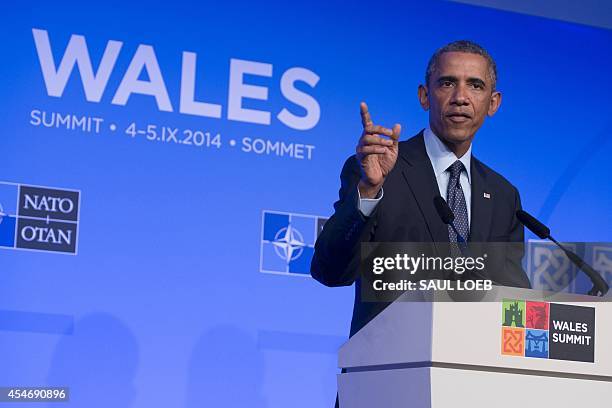 President Barack Obama gestures during a press conference on the second day of the NATO 2014 Summit at the Celtic Manor Resort in Newport, South...