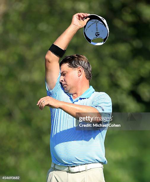 Roland Thatcher wipes his brow on his sleeve during the second round of the Chiquita Classic held at River Run Country Club on September 5, 2014 in...