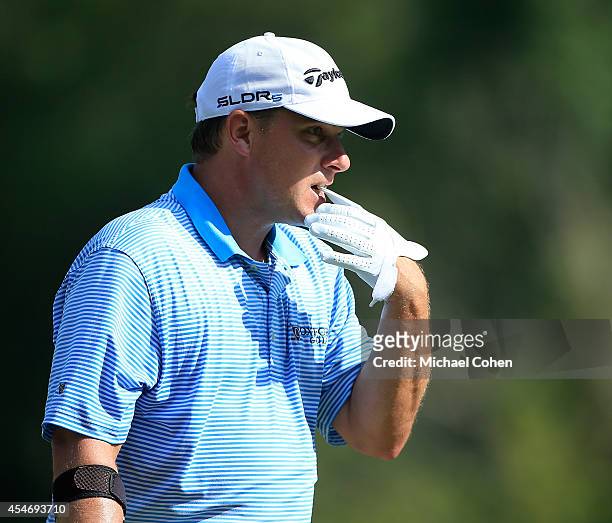 Roland Thatcher tugs off his glove during the second round of the Chiquita Classic held at River Run Country Club on September 5, 2014 in Davidson,...