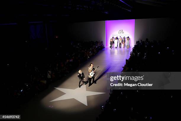 Fashion designers Estel Day and Mark Tango perform on the runway with models at the Mark And Estel fashion show during Mercedes-Benz Fashion Week...