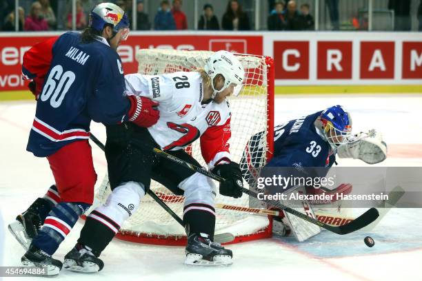 Troy Milam of Salzburg and his goalie Luka Gracnar fights with Miika Lahti of Jyvaskyla during the Champions Hockey League group 1 between Red Bull...