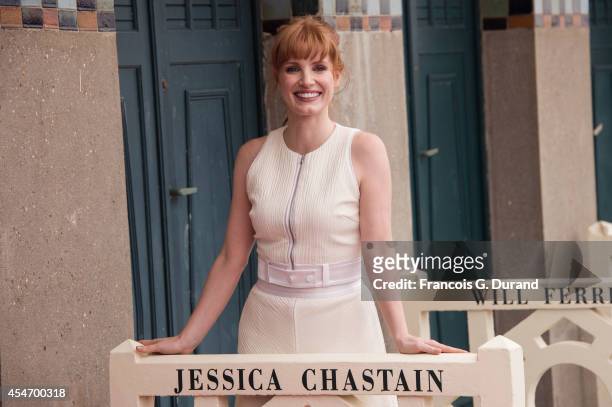 Jessica Chastain poses in front of her dedicated beach locker room on the Promenade des Planches on September 5, 2014 in Deauville, France.