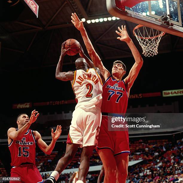 Stacey Augmon of the Atlanta Hawks shoots against the Washington Bullets circa 1994 at the OMNI in Atlanta, Georgia. NOTE TO USER: User expressly...