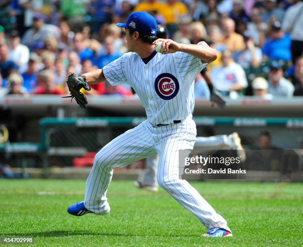 Tsuyoshi Wada of the Chicago Cubs throws out a hitter during the third inning against the Pittsburgh Pirates on September 5, 2014 at Wrigley Field in...