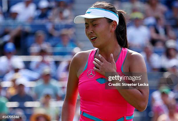 Shuai Peng of China reacts after getting injured during her women's singles semifinal match against Caroline Wozniacki of Denmark on Day Twelve of...