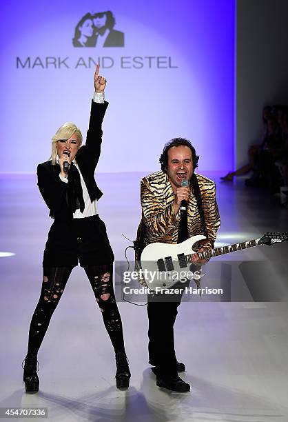 Fashion designers Estel Day and Mark Tango pose on the runway at the Mark And Estel fashion show during Mercedes-Benz Fashion Week Spring 2015 at The...