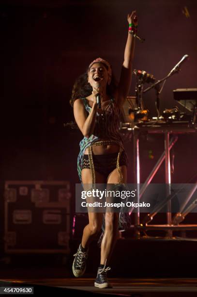 Eliza Doolittle performs on stage with Disclosure at Bestival 2014 at Robin Hill Country Park on September 5, 2014 in Newport, United Kingdom.