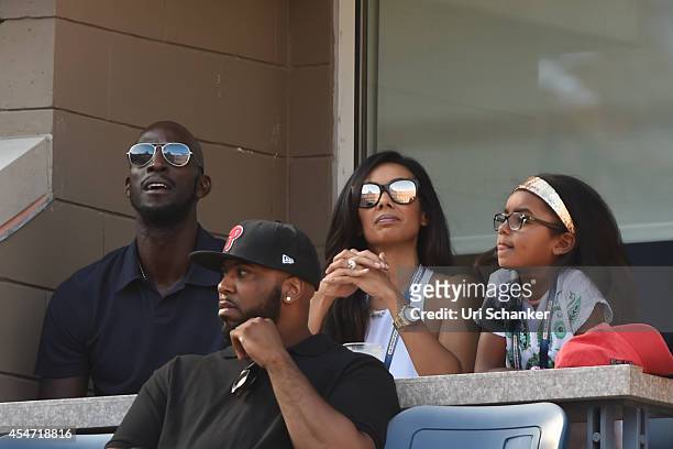 Kevin Garnett, Brandi Padilla and Capri Garnett attend day 12 of the 2014 US Open at USTA Billie Jean King National Tennis Center on September 5,...