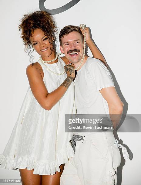 Rihanna and Adam Selman pose for a photo after Adam Selman's presentation during Mercedes-Benz Fashion Week Spring 2015 at Algus Greenspon Gallery on...