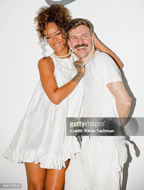 Rihanna and Adam Selman pose for a photo after Adam Selman's presentation during Mercedes-Benz Fashion Week Spring 2015 at Algus Greenspon Gallery on...