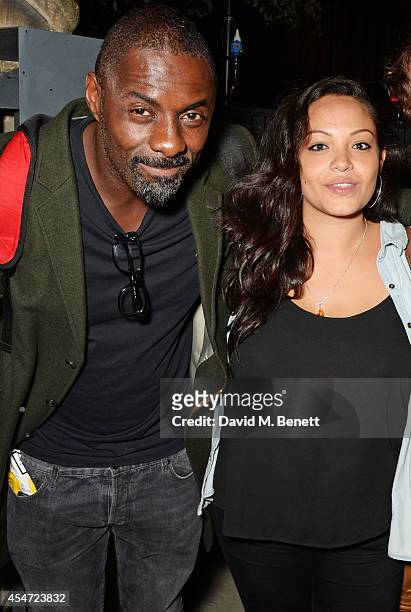Idris Elba and Naiyana Garth attend the Soho House event to celebrate Kasabian's performance at the iTunes Festival London on September 5, 2014 in...