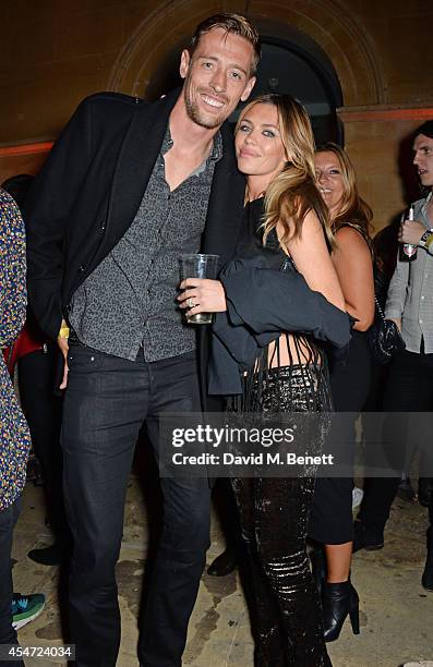 Peter Crouch and Abbey Clancy attend the Soho House event to celebrate Kasabian's performance at the iTunes Festival London on September 5, 2014 in...