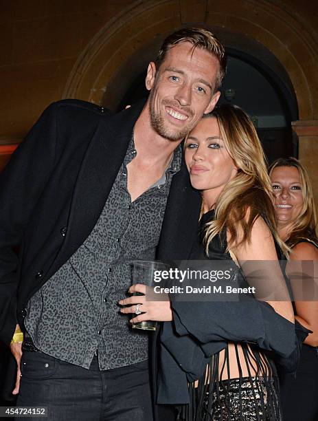 Peter Crouch and Abbey Clancy attend the Soho House event to celebrate Kasabian's performance at the iTunes Festival London on September 5, 2014 in...