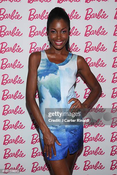 Models pose wearing Tess Giberson design for Barbie at Barbie And CFDA Event on September 5, 2014 in New York City.