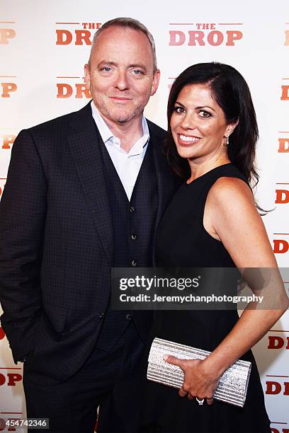 Executive Producer/screenwriter Dennis Lehane and his wife Angela Bernardo pose for a portrait at 'The Drop' after party during the 2014 Toronto...