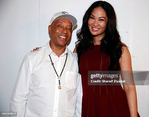 Kimora Lee Simmons and Russell Simmons attend the Argyleculture By Russell Simmons show at Mercedes-Benz Fashion Week Spring 2015 at Helen Mills...