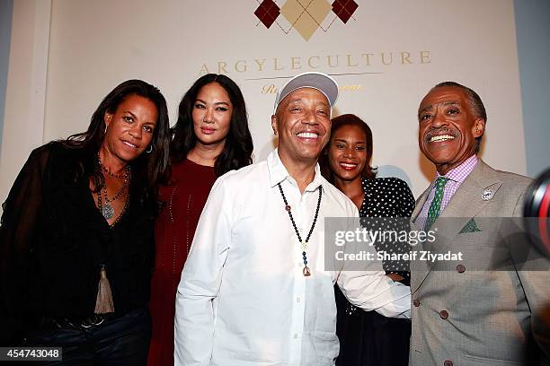 Kimora Lee Simmons, Russell Simmons and Al Sharpton attend the Argyleculture By Russell Simmons show at Mercedes-Benz Fashion Week Spring 2015 at...