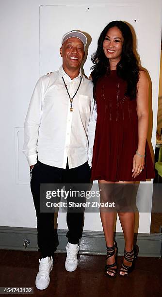 Kimora Lee Simmons and Russell Simmons attend the Argyleculture By Russell Simmons show at Mercedes-Benz Fashion Week Spring 2015 at Helen Mills...