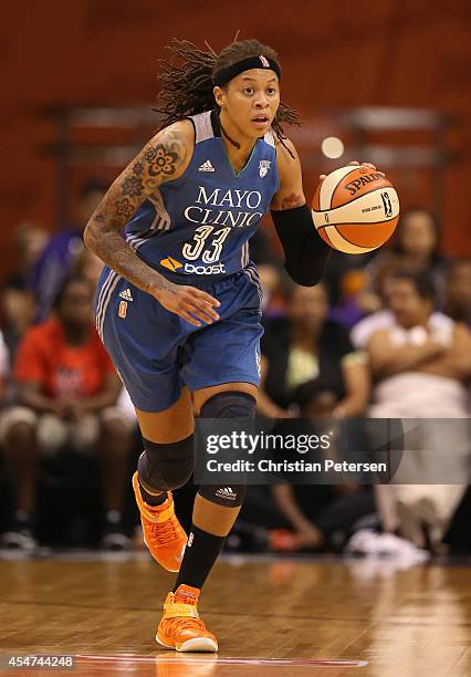 Seimone Augustus of the Minnesota Lynx handles the ball during game three of the WNBA Western Conference Finals against the Phoenix Mercury at US...