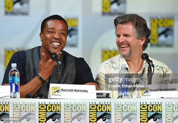 Actor Russell Hornsby and writer/producer David Greenwalt attend the "Grimm" season four panel during Comic-Con International 2014 at the San Diego...