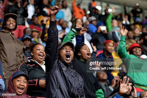 Members of the public attend the Nelson Mandela memorial service at the FNB Stadium, on December 10, 2013 in Johannesburg, South Africa. Over 60...