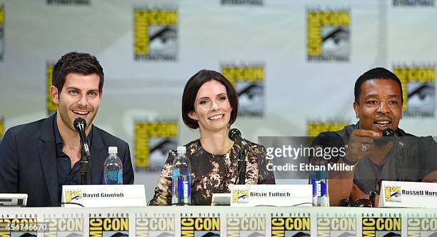 Actor David Giuntoli, actress Bitsie Tulloch and actor Russell Hornsby attend the "Grimm" season four panel during Comic-Con International 2014 at...