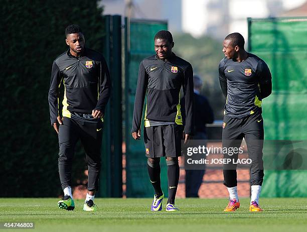 Barcelona's Cameroonian midfielder Alexandre Song , Barcelona's Cameroonian forward Jean-Marie Dongou and Barcelona's forward Adama Traore Diarra...