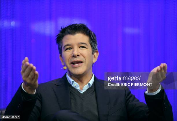 Travis Kalanick, Co-Founder and CEO of Uber, a mobile application connecting passengers with drivers of vehicles for hire, talks during a session of...