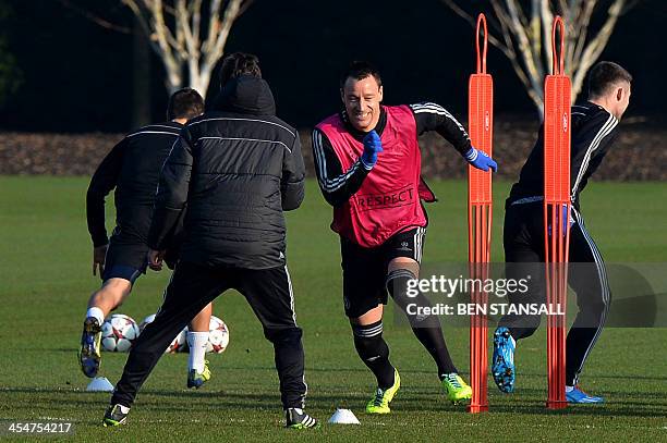 Chelsea's English defender John Terry attends a training session at the club's training ground in Cobham, Surrey, south of London, on December 10,...