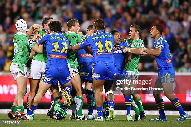 Eels and Raiders players engage in a scuffle during the round 26 NRL match between the Canberra Raiders and the Parramatta Eels at GIO Stadium on...