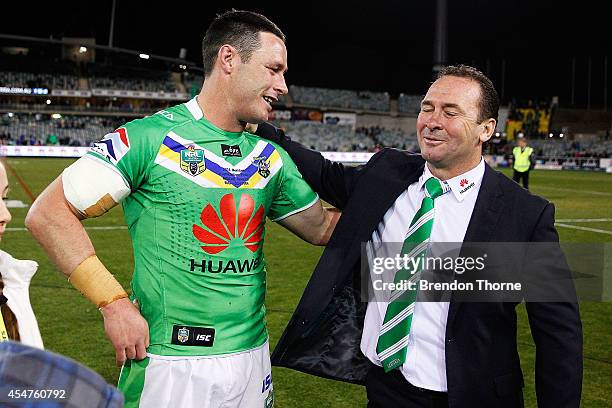 Brett White of the Raiders embraces coach, Ricky Stuart following the round 26 NRL match between the Canberra Raiders and the Parramatta Eels at GIO...